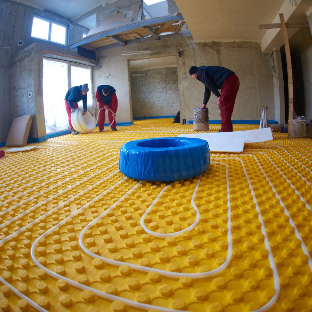 construction-workers-installing-radiant-floor-heat-2026-04-13-23-25-48-utc